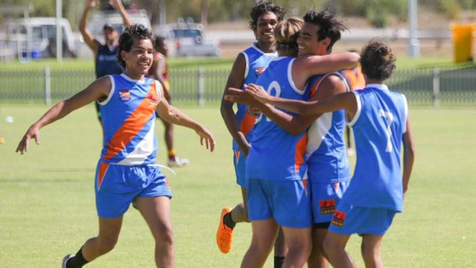 Clontarf students celebrating a game in Alice Springs
